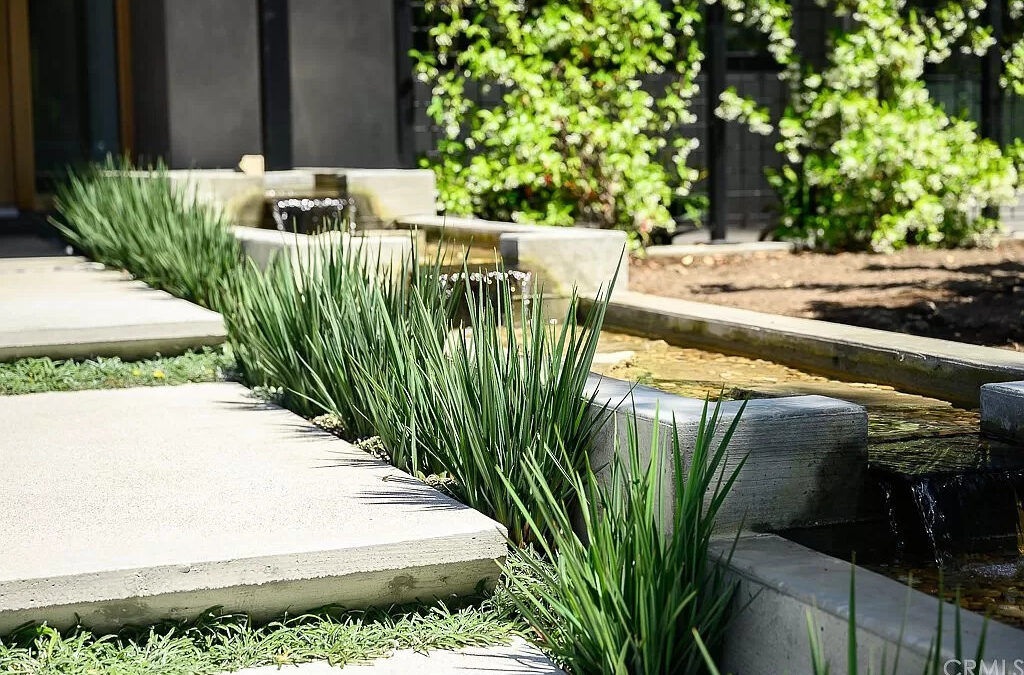 Housing market featuring a plant-rich front patio.