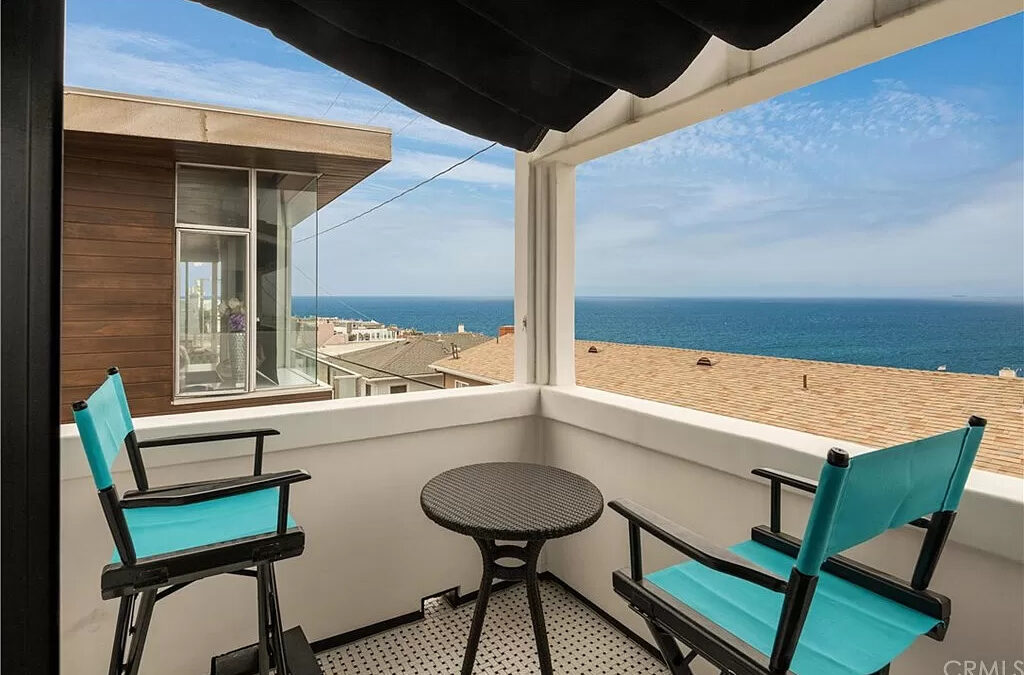 Beautiful beach home patio while foreclosure threat grows.