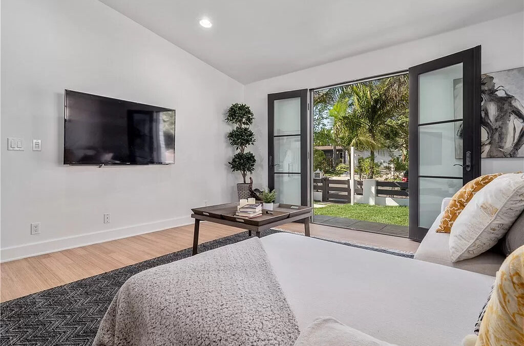 Housing market featuring a gorgeous bedroom with a grey/white color theme.